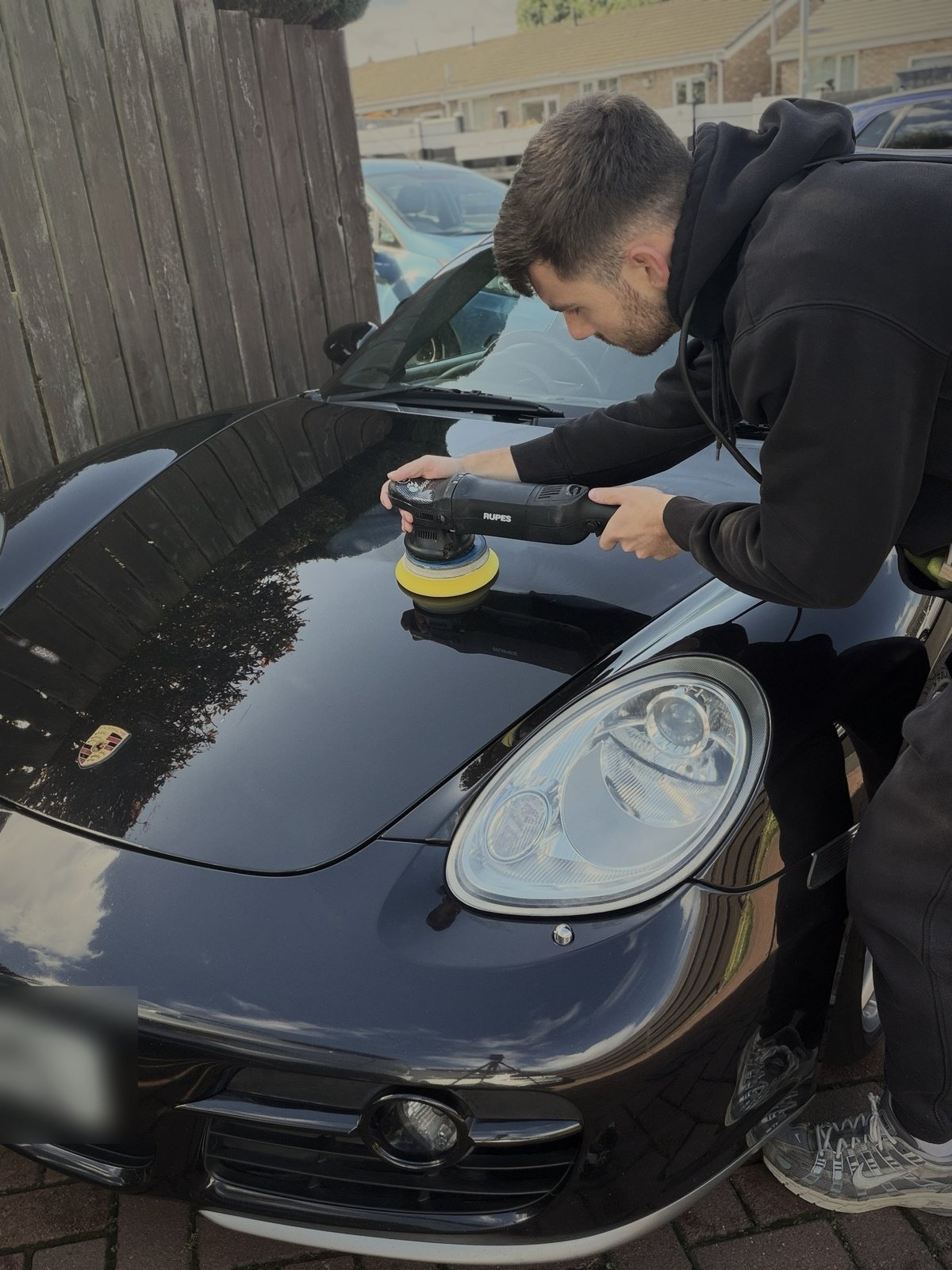 Machine polishing a Porsche by ARDEN Detailing