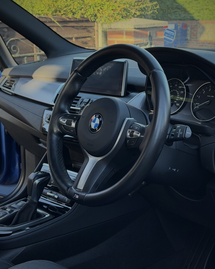 Steering wheel after an ARDEN deep clean, with a clean matte factory finish