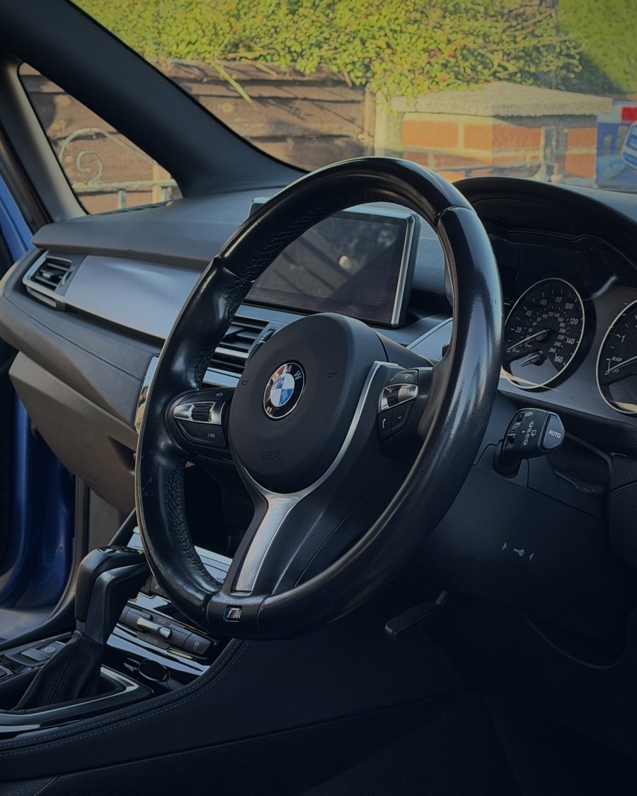 Steering wheel before cleaning, shiny with grease and grime